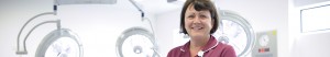 A female staff member in a raspberry tunic in an operating theatre.
