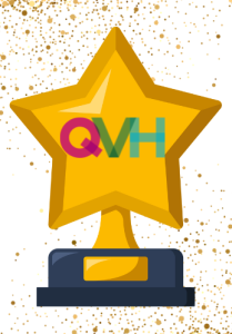 A clip art image of a star-shaped trophy with the QVH logo in the middle, and gold glitter / confetti in the background.